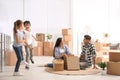 Happy family unpacking moving boxes at their home Royalty Free Stock Photo