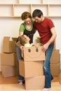 Happy family unpacking in their new home Royalty Free Stock Photo