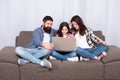 Happy family using laptop. Stay online. little girl with parents. mother and bearded father with daughter looking at