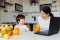 Happy family using a tablet pc in kitchen Royalty Free Stock Photo