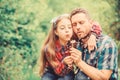 Happy family vacation. Father and little girl enjoy summertime. Dad and daughter blowing dandelion seeds. Keep allergies Royalty Free Stock Photo