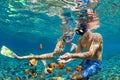 Young couple in snorkeling mask dive underwater in tropical sea Royalty Free Stock Photo