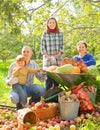 Happy family with vegetables harvest