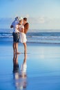 Happy family walking with fun on sunset sea beach Royalty Free Stock Photo