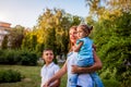 Happy family walking outdoors in park. Mother with two children son and daughter relaxing together. Royalty Free Stock Photo