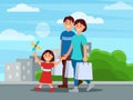 Happy family walking by park after shopping. Mother, father and their daughter. Buildings and green bushes on background Royalty Free Stock Photo