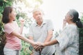 Happy family walking together in the garden. Old elderly using a walking stick to help walk balance. Concept of  Love and care of Royalty Free Stock Photo