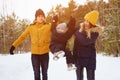 Happy family walking in winter day in forest. Family, weekend and holiday concept Royalty Free Stock Photo