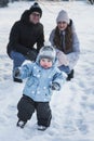 Happy family walking in winter park Royalty Free Stock Photo