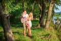 Happy family walks in a lakeside park