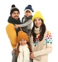 Happy family in warm clothes on background. Winter vacation