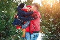 Happy family in warm clothes in the winter outdoors. Concept of holidays, holidays, winter, new year, day of grace. Family Royalty Free Stock Photo