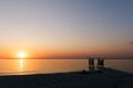 happy family watching the sunset on the beach Royalty Free Stock Photo