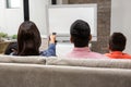 Happy family watching tv on the sofa Royalty Free Stock Photo