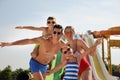 Happy family in water park on sunny day Royalty Free Stock Photo