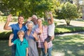 Happy family waving at camera