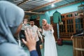 happy family welcoming guest to their house during eid mubarak Royalty Free Stock Photo