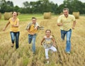 Happy family in wheat field Royalty Free Stock Photo