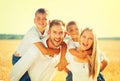 Happy family on wheat summer field Royalty Free Stock Photo