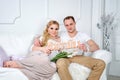 Happy family in white living room. Man and woman Royalty Free Stock Photo