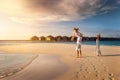 A happy family on holidays is having fun on a tropical beach Royalty Free Stock Photo