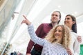 Happy family window shopping in mall Royalty Free Stock Photo