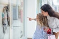 Happy family window shopping in mall Royalty Free Stock Photo