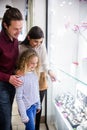 Happy family window shopping in mall Royalty Free Stock Photo