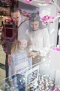 Happy family window shopping in mall Royalty Free Stock Photo