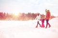 Happy family in winter clothes walking outdoors Royalty Free Stock Photo