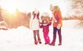 Happy family in winter clothes walking outdoors Royalty Free Stock Photo