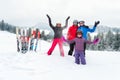 Happy family in winter clothing at ski resort - skiing, winter, snow, fun - mom and daughters enjoying winter vacations