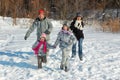 Happy family in winter, having fun with snow outdoors Royalty Free Stock Photo