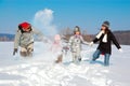 Happy family in winter, having fun with snow outdoors Royalty Free Stock Photo