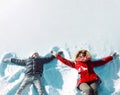 Happy family in winter time! mother with son child lying on snow Royalty Free Stock Photo