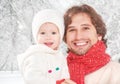 Happy family on a winter walk, father and child baby daughter outdoors Royalty Free Stock Photo