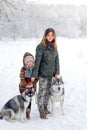 Happy family in the winter wood Royalty Free Stock Photo