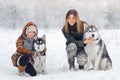 Happy family in the winter wood plays Royalty Free Stock Photo