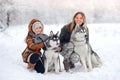 Happy family in the winter wood plays Royalty Free Stock Photo