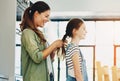 Happy family, woman and daughter in hair care with bonding, affection and trust in home for memory as preteen. Cheerful Royalty Free Stock Photo