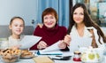 Happy family working with papers Royalty Free Stock Photo