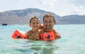 Happy family. Young beautiful father and his smiling son baby boy having fun on the beach of the sea, ocean. Positive human emotio Royalty Free Stock Photo