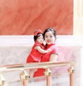 happy family young Chinese mother has fun with baby in China traditional cheongsam