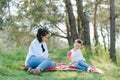 Happy family; young mother and her five year old son spending time outdoor on a summer day. concept of family boy and happy Royalty Free Stock Photo