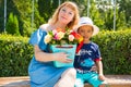 Happy family. Young mother and kid boy on sunny day. Portrait mom and son on nature. Positive human emotions, feelings, joy. Royalty Free Stock Photo