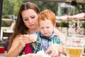 Happy family. Young mother and kid boy on sunny day. Portrait mom and son on nature. Positive human emotions, feelings, joy. Royalty Free Stock Photo