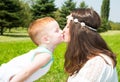 Happy family. Young mother and kid boy on sunny day. Portrait mom and son on nature. Positive human emotions, feelings, joy. Royalty Free Stock Photo