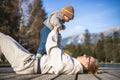 Happy family. Young mother playing with her baby boy infant oudoors on sunny autumn day. Portrait of mom and little son Royalty Free Stock Photo