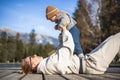 Happy family. Young mother playing with her baby boy infant oudoors on sunny autumn day. Portrait of mom and little son Royalty Free Stock Photo