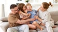 Happy beautiful family having fun and playing while relaxing on sofa in living room Royalty Free Stock Photo